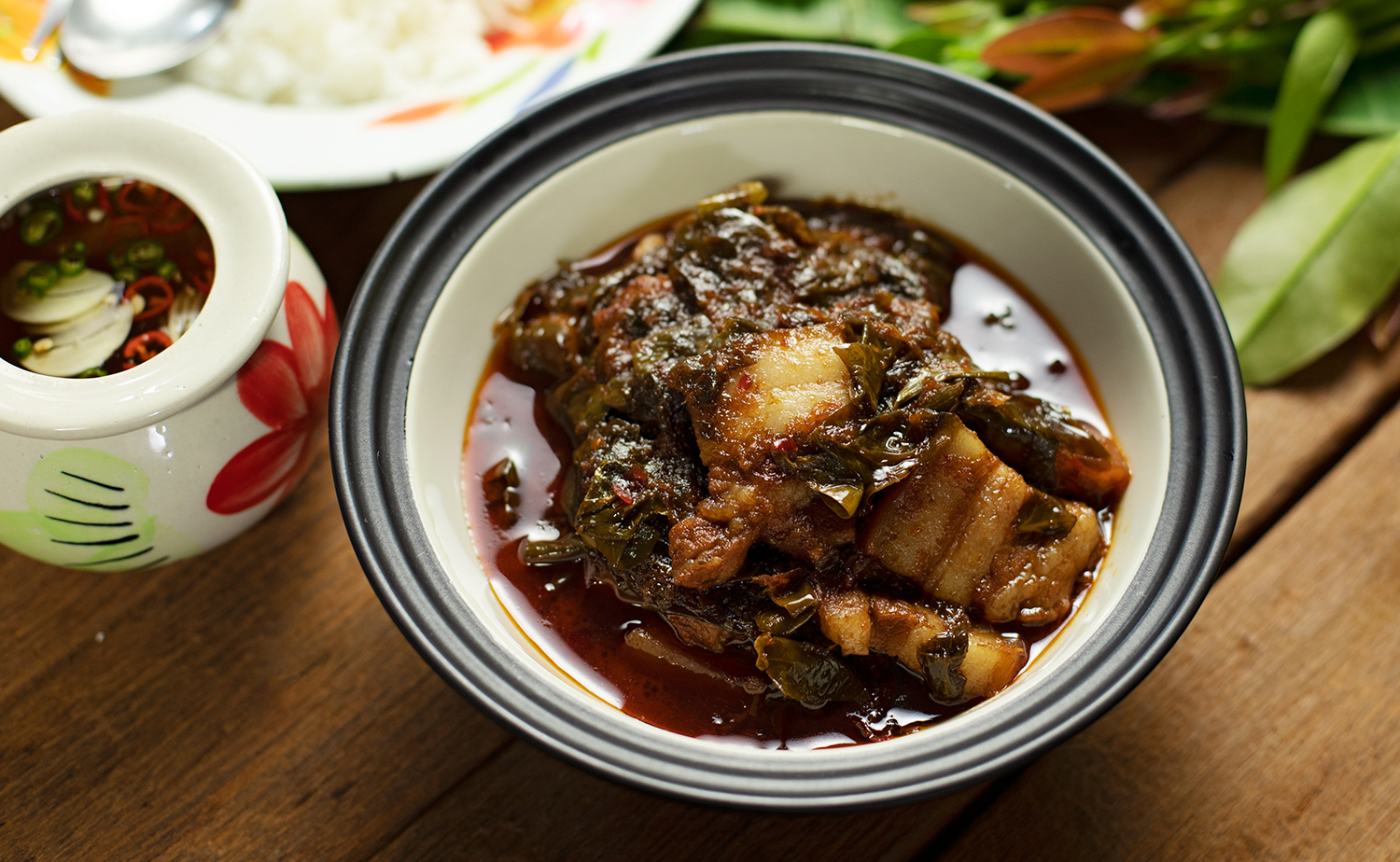 Braised Pork Belly with Cowa Leaves (แกงหมูใบชะมวง)
