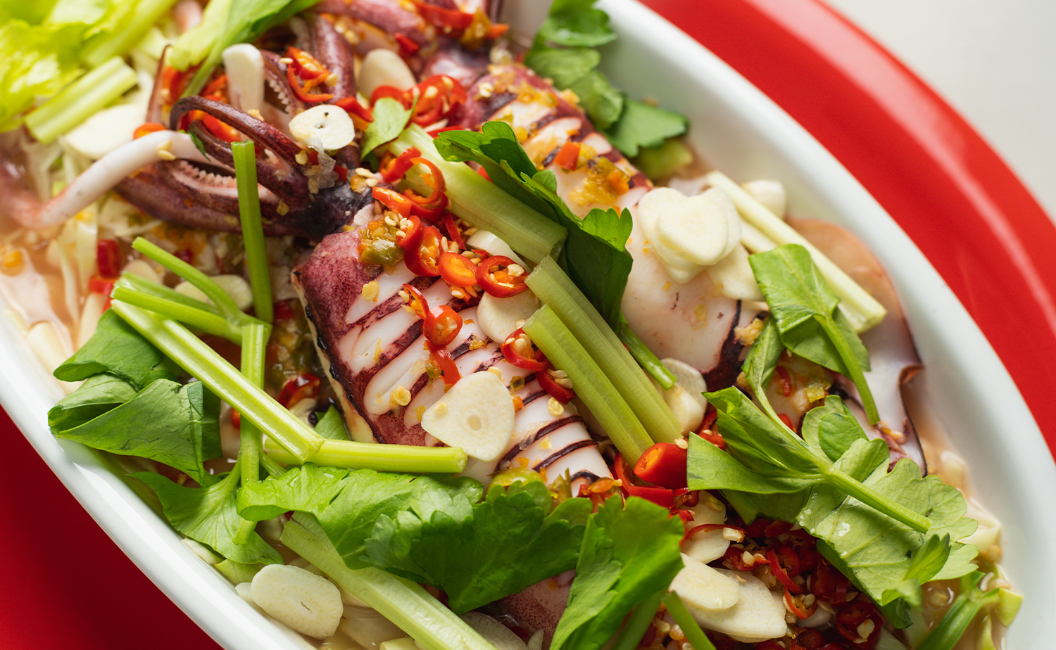 Steamed Squid with Spicy and Sour Sauce (หมึกนึ่งมะนาว)